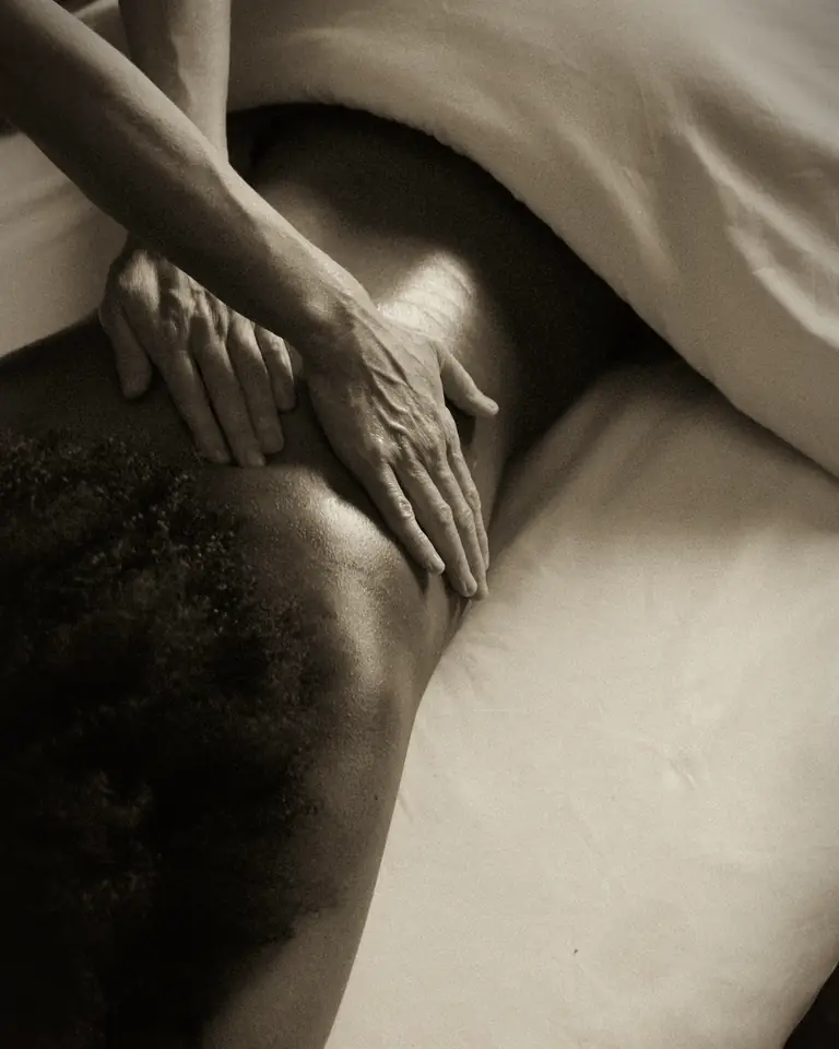 Relaxing home spa massage in low candlelight in Dubai